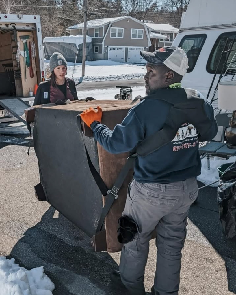 Team Carrying Couch Through Doorway